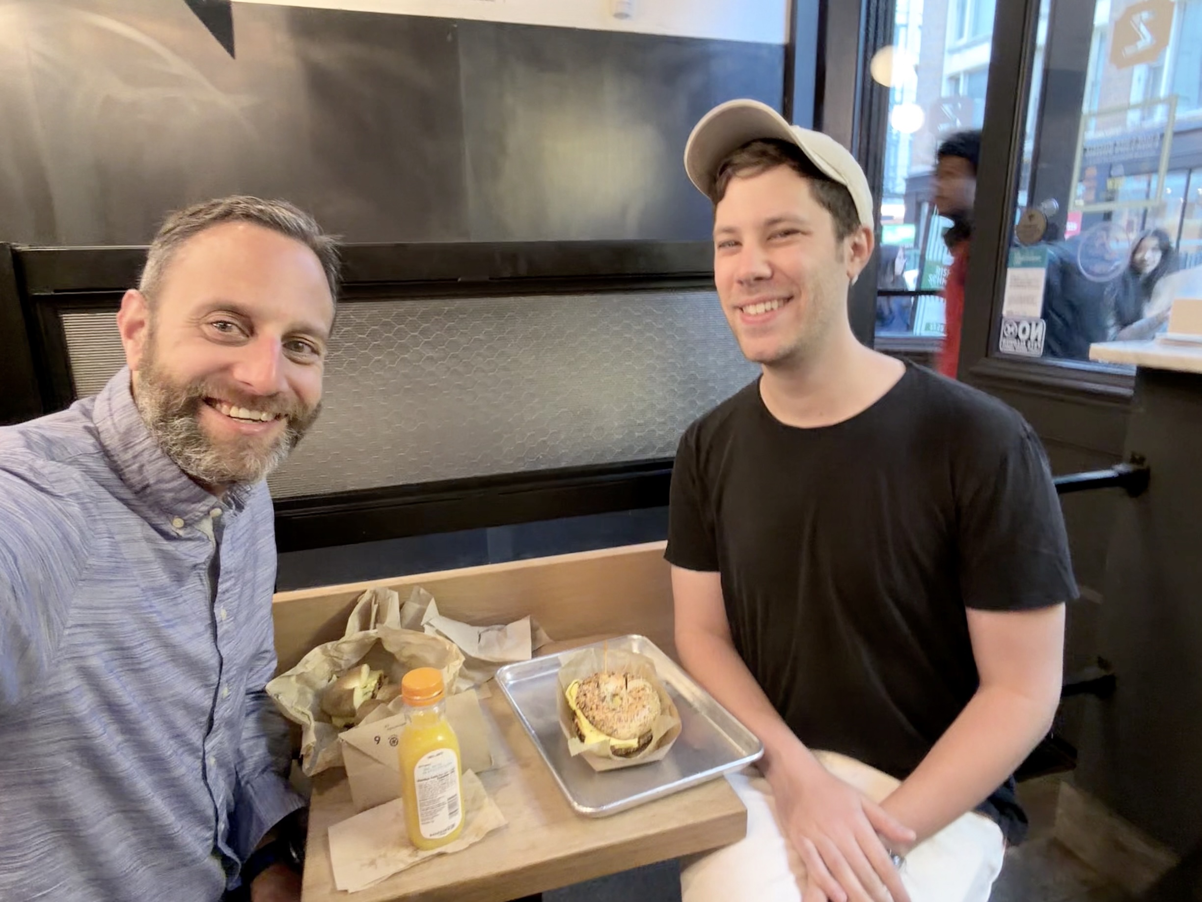 Photo of Adam and me about to tear up some bagels